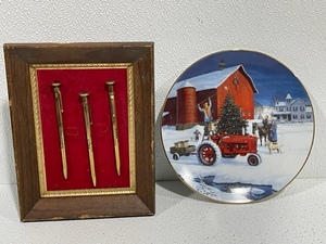 Case Hanging the Star Collectible Plate and Minnesota Steamer Souvenirs