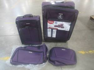 lot 803 image: American Tourister 4 Piece Luggage Set in Purple.