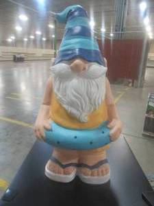 lot 805 image: 22 Tall Garden Gnome in swimsuit and innertube.