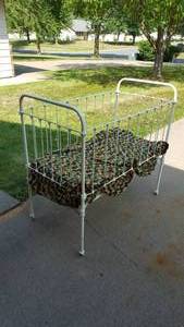lot 104A image: Antique Cast Iron Baby Crib