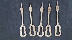 lot 125 image: Vintage Dairy Milk Bottle Openers