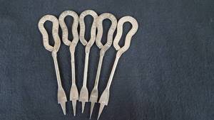 lot 126 image: Vintage Dairy Milk Bottle Openers