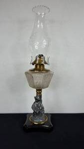 lot 142 image: Antique Kerosene Figural Composite Lamp