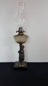 lot 39 image: Antique Kerosene Figural Composite Lamp