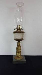lot 44 image: Antique Kerosene Figural Composite Lamp