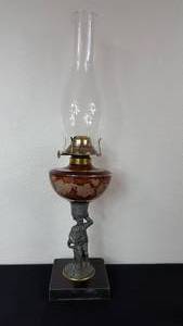 lot 68 image: Antique Kerosene Figural Composite Lamp Ruby Flashed