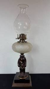 lot 85 image: Antique Kerosene Figural Composite Lamp