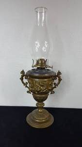 lot 86 image: Antique Kerosene Figural Composite Lamp