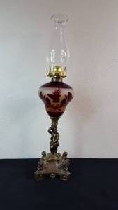 lot 4 image: Antique Kerosene Figural Composite Lamp Ruby Flashed