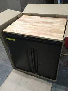 lot 34 image: Husky Heavy Duty Welded 20-Gauge Steel 1-Drawer 2-Door Garage Base Cabinet in Black (28 in. W x 32 in. H x 21.5 in. D) Customer Returns See Terms on Auction