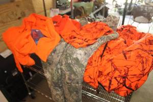lot 649 image: Lot of (1 Bag) Size XL Hunting Clothes - Jacket, Snow Pants, Shirt, Stocking Hats (x3), Hood