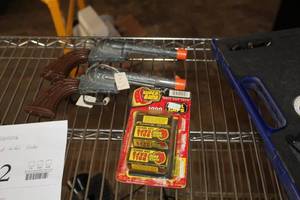 lot 763 image: Lot of (2) Vintage Cap Hand Guns with (3 boxes) Caps