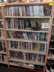 Contents of (7) Shelves- DVDs, Disney VHS, Games and More - Shelves are about 35 Long each