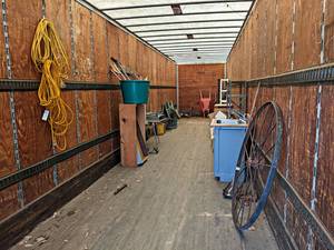 Contents of Semi Trailer - Steel Wheel, Wheelbarrow, Desks, Extension Cords, Cardboard Boxes, Ladder, Hose, Sink and More- take what you want leave the rest