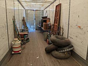 Contents of the Back 25 of Semi Trailer - Antique Milk Cans, Seeder, Folding Tables, Yard Tools and More- take what you want leave the rest
