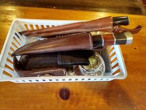 lot 16 image: Small Tote of Knives & Belt Buckles