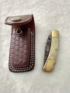 lot 569 image: Damascus Steel Folding Knife & Sheath