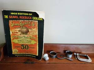 1902 Edition Of The Sears And Roebuck Catalog And Misc. Metal Items