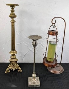 lot 63 image: Trio of Candle Holders Tall Brass Candle Holder, Silver Toned Candle Holder, Copper Hanging Lantern with Stand