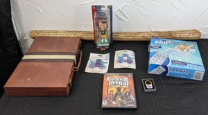lot 71 image: Mixed Lot New 2002 NFL Brett Favre Bobblehead, Backgammon Set in Case, (2) New Fidget Spinners, New H20 Go Pool Float, PS2 Guitar Hero III Game, and More