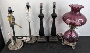 lot 77 image: Lot of (5) Table Lamps (2) New Better Homes & Gardens Silver Lamp Bases, (2) Dark Brown Lamp Bases, Purple Glass Electric Hurricane Lamp