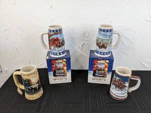 lot 35 image: Ducks Unlimited Miller Mug, (2) 1995 Budweiser Holiday Mugs, 1989 Budweiser Holiday Mug