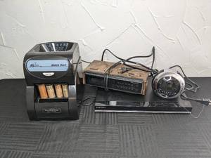 lot 87 image: Royal Sovereign Fast Sort Coin Sorter, Vintage Panasonic AM-FM Digital Clock Radio, Coby Digital Alarm Clock with Projector Display, Samsung Digital Video Disc DVD Player