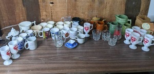 lot 331 image: Large Assortment of Glass Cups, Mugs, Pottery Mugs, HJ Wood Burslem England Mug and More