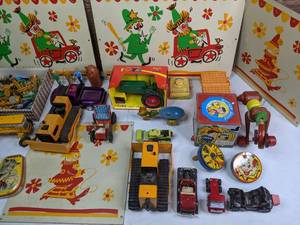 lot 320 image: New and Vintage Childrens Toys - Fisher Price Pocket Radio, Jack in the Box, Clowns, Tractors, Tonka Truck, Candy Tins, and more