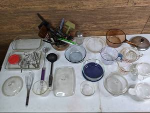 lot 321 image: Pyrex Dishes and Assorted Kitchen Utensils - Mixing Bowls, Baking Dishes, Knives, Measuring Cups, Spatulas, Ladles, and more