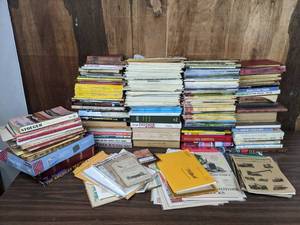 lot 264 image: An Assortment of Paperback Books International Harvester, Sheet Metal, Buick, Self Defense, National Geographic, Bathrooms, Etc.