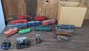 lot 234 image: Vintage Train Cars, Tracks, Toy Transformer, Tracks Installed on Plywood, and More