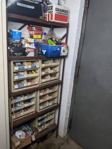 lot 173 image: Metal Garage Shelf Plus Contents Organizational Bins Contain Screws, Washers, Anchors, Nails, Tape, and More