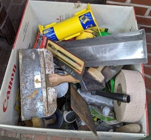 lot 171 image: Box of Miscellaneous Drywall and Painting Supplies Trowels, Joint Tape, Brushes, Caulk, Sanding Block, and More