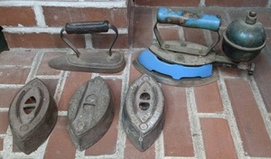 lot 166 image: Collection of Five VintageAntique Irons Best on Earth, Colebrookdale Iron Co., Coleman Gas Powered Iron, and More