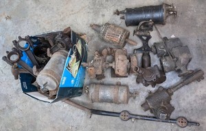 lot 142 image: Collection of Antique Auto Parts Delco Ignition, Stewart Vacuum Gasoline System, and Much More