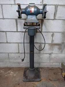 lot 134 image: Vintage Baldor Electric Grinder Model 619 Mounted on a Vintage Black & Decker Electric Grinder Pedestal