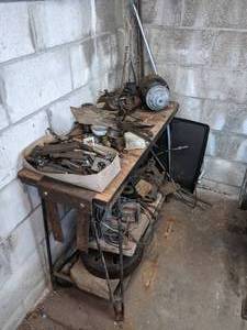 lot 135 image: Shop Table with Assortment of Vintage Car Parts and Tools