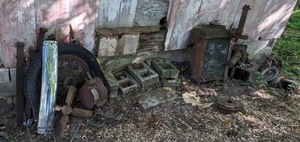 lot 43 image: Vintage Ornate Universal Waffle Iron E9314, Radiator, WheelTire, Grill, Fan Blade, Kaiser Chrome Logo, Gas Caps, and More Scrap Metal