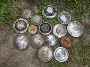 lot 23 image: Collection of (15) Vintage Hubcaps from Chevrolet, Ford, Mercedes, Rambler, Dodge, and More