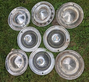 lot 25 image: Collection of (8) Vintage Hubcaps from Chevrolet, Ford, Buick, and More