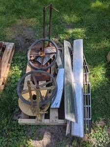 lot 30 image: Collection of Vintage and Antique Car Parts Steering Wheels, Pedals, Grill, and More