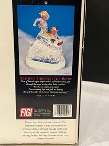 lot 98 image: Figi Santas Crystal Valley Figurines Dashing Through the Snow & A Secret Recipe