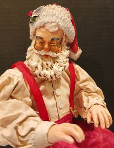 lot 131 image: Musical The American Artist Clothtique Piano-Playing Santa Music Box