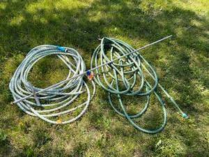 lot 215 image: Garden Hose & Watering Rod