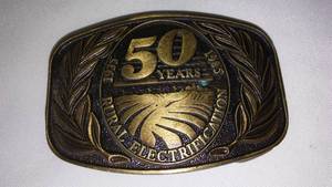 lot 171 image: 50th Anniversary Rural Electrification Belt Buckle 1985