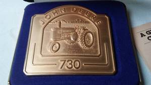 lot 311 image: John Deere Belt Buckle 730 Tractor 27936000