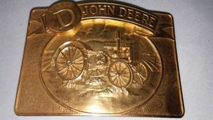 lot 335 image: John Deere Belt Buckle Model-D Tractor 58386000