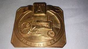 lot 349 image: John Deere Belt Buckle Modal A Tractor 26096000