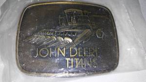 lot 356 image: John Deere Belt Buckle Titans Combines Factory Wrap
